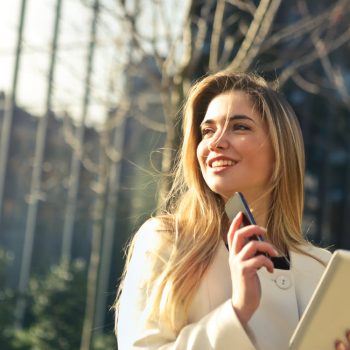 young woman on cell phone and tablet