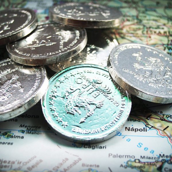 euro coins on top of map