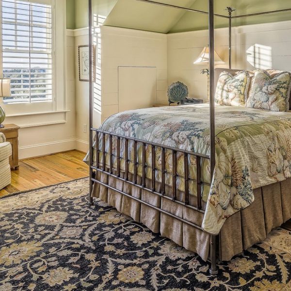 bedroom with hardwood floors and carpet